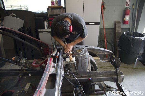 Chris working on some extra bracing after cutting my wheel wells out.